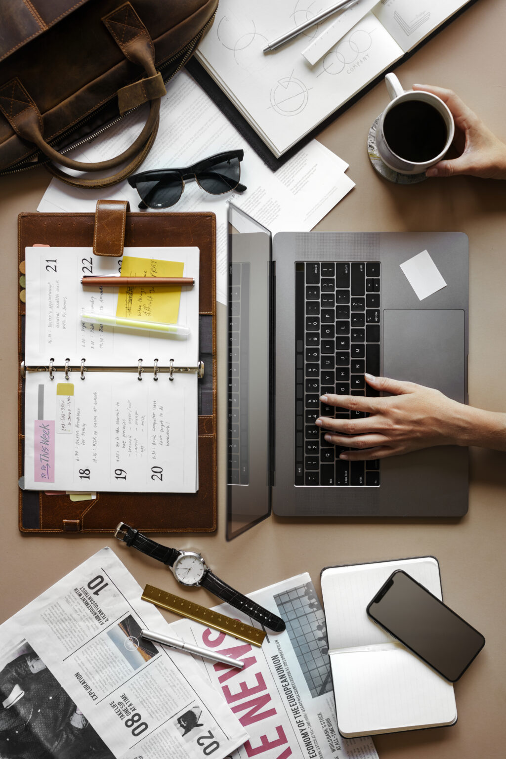 Coffee and a laptop on a desk