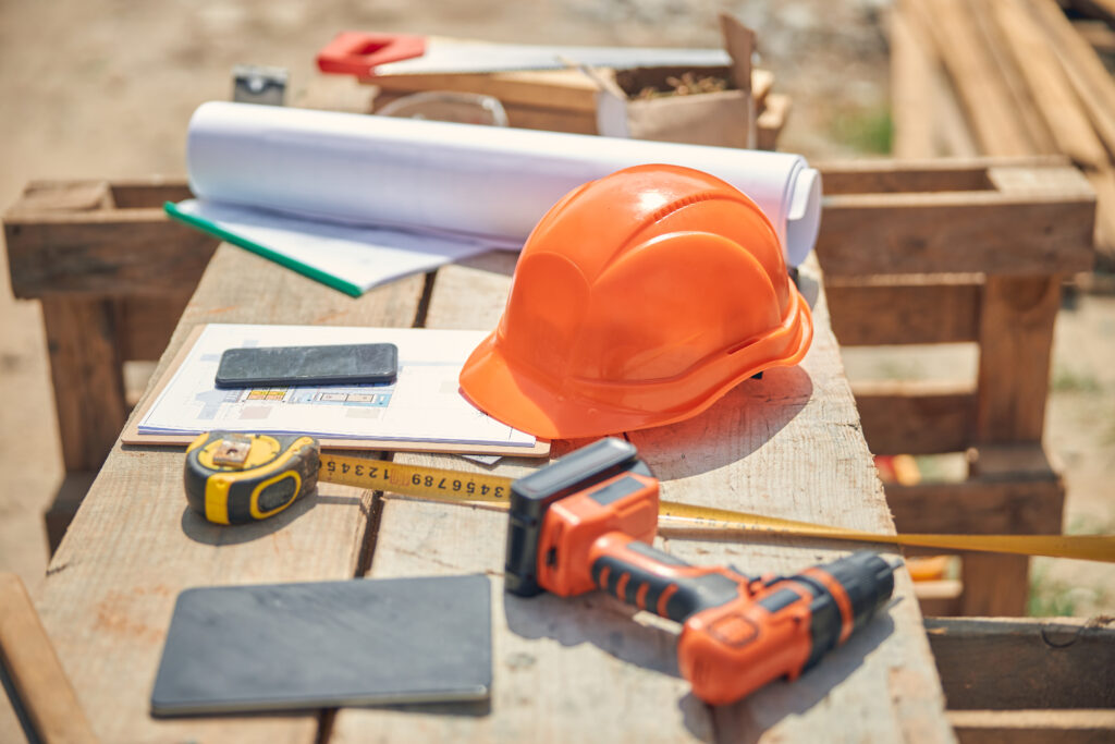 Construction tools and blueprints